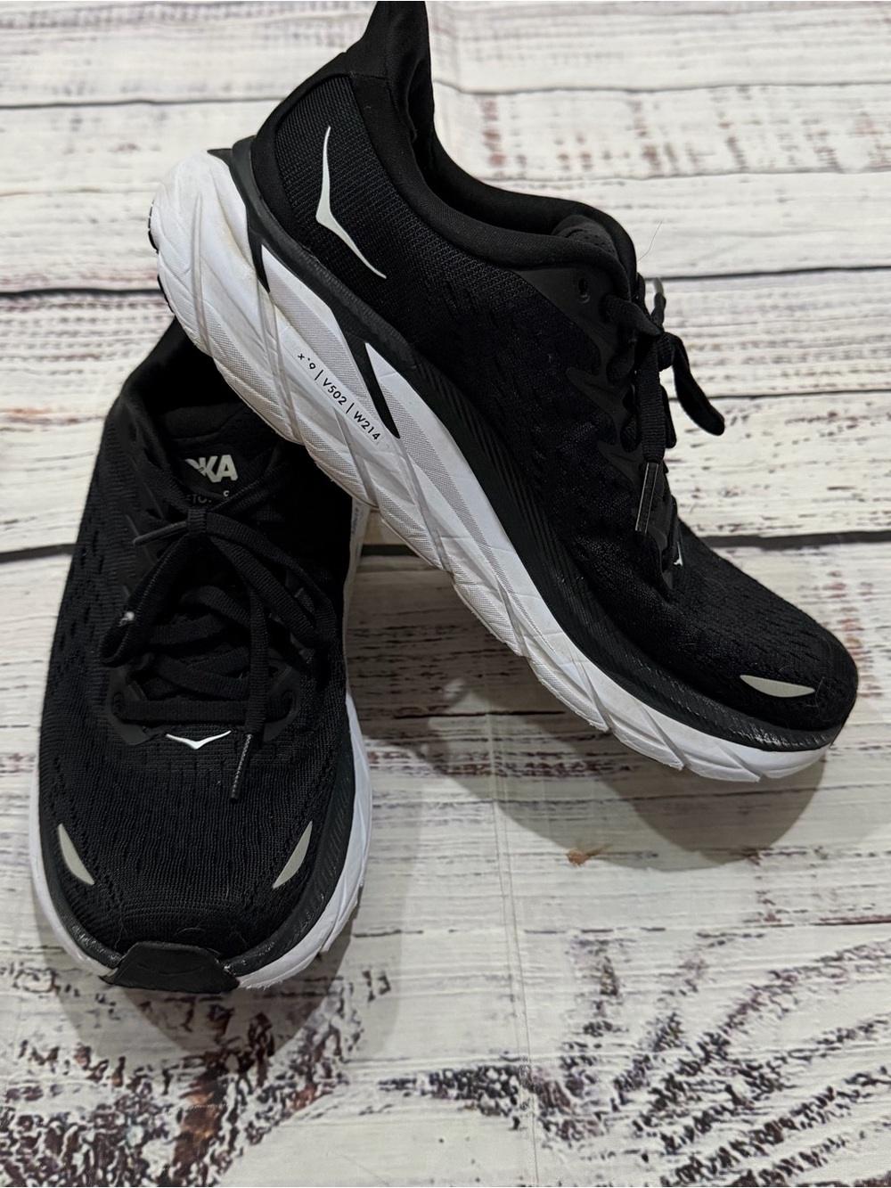 HOKA women’s  Black and White Running Shoes